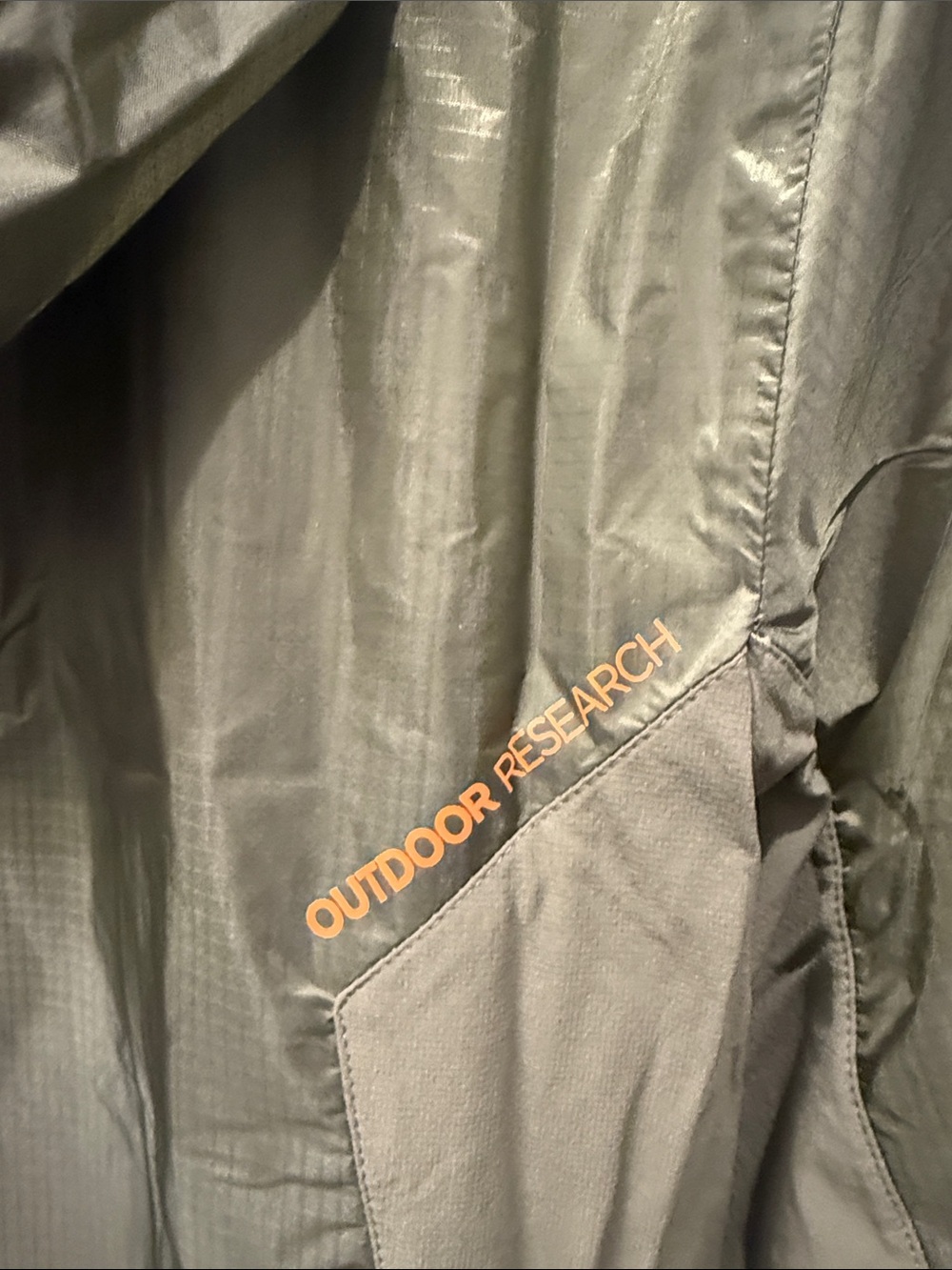 Outdoor Research Helium II jacket in green with orange zipper details. - Picture 6 of 7